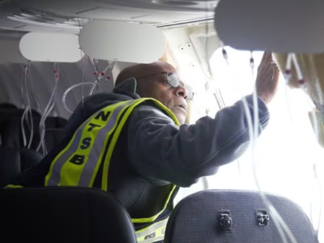 national transportation safety board ntsb investigator in charge john lovell examines the fuselage plug area of alaska airlines flight 1282 boeing 737 9 max which was forced to make an emergency landing with a gap in the fuselage in portland oregon u s january 7 2024 ntsb handout via photo reuters national transportation safety board ntsb investigator in charge john lovell examines the fuselage plug area of alaska airlines flight 1282 boeing 737 9 max which was forced to make an emergency landing with a gap in the fuselage in portland oregon u s january 7 2024 ntsb handout via photo reuters