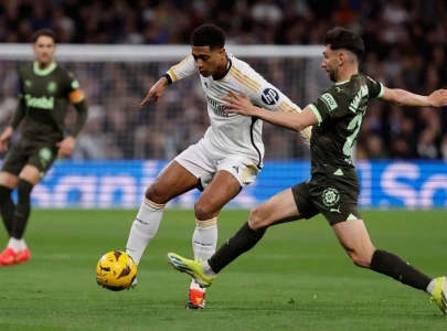 bellingham brace helps leaders madrid crush title rivals girona