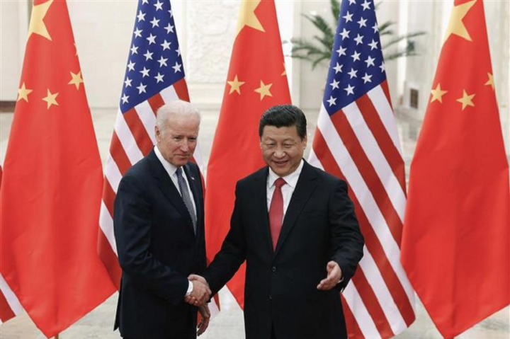 chinese president xi jinping r shakes hands president joe biden l inside the great hall of the people in beijing december 4 2013 photo reuters
