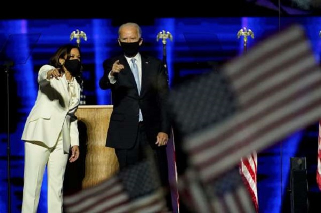 Democratic 2020 US presidential nominee Joe Biden joins vice presidential nominee Kamala Harris onstage at their election rally, after the news media announced that Biden has won the 2020 US presidential election over President Donald Trump, in Wilmington, Delaware, US, November 7, 2020. PHOTO: REUTERS