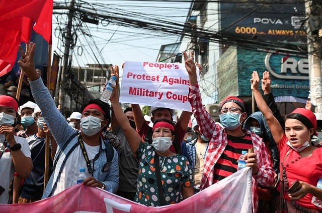 demonstrators show the three finger salute to protest against the military coup and demand the release of elected leader aung san suu kyi in yangon myanmar february 6 2021 photo reuters