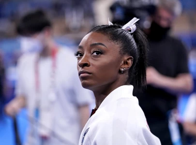 many twisties and turns but simone biles exits games a champion