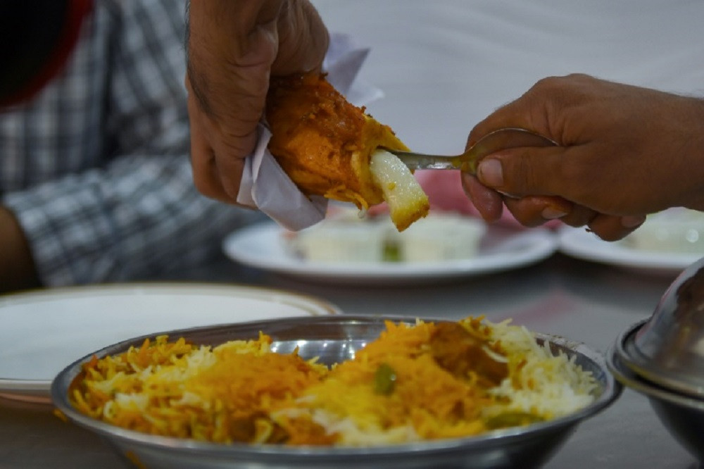 Every Karachi neighbourhood has its own canteens fronted by vendors clanking a spatula against the inside of biryani pots. PHOTO: AFP