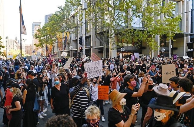 protesters rally outside town hall in response to the treatment of women in politics following several sexual assault allegations as part of the women s march 4 justice rally in sydney australia march 15 2021 photo reuters