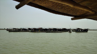 sindh s centuries old boat village faces dual threat