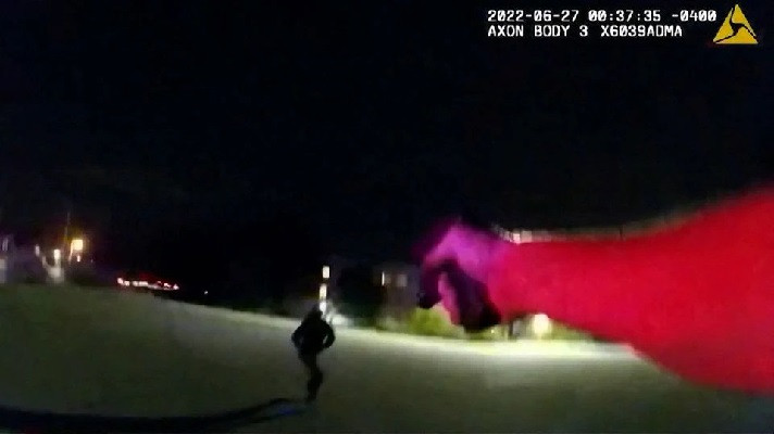 an akron police officer points his weapon at black man jayland walker who was shot to death by up to eight officers after running from his vehicle in akron ohio us june 27 2022 in a still image from police body camera video photo reuters