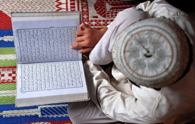 a muslim boy reads the holy quran at a madrasa in the northern indian city of mathura august 23 2009 photo reuters a muslim boy reads the holy quran at a madrasa in the northern indian city of mathura august 23 2009 photo reuters