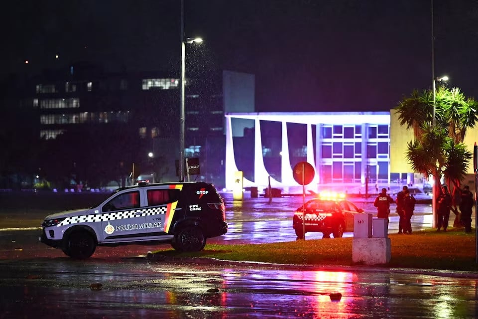 police vehicles are seen in front of the brazilian supreme court after explosions in the three powers square in brasilia brazil on november 13 2024 photo reuters