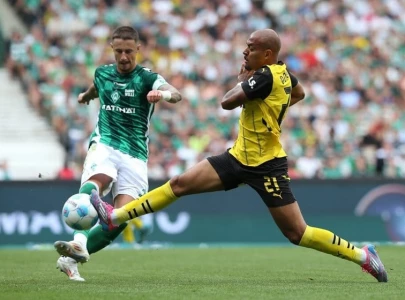 bremen hold firm against 10 man dortmund in goalless draw