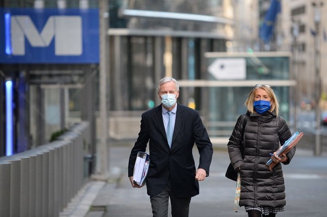 eu chief brexit negotiator michel barnier leaves the eu commission for a meeting of the permanent representatives committee in brussels belgium december 25 2020 photo reuters