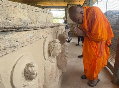 buddhist devotees explore heritage sites