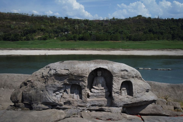 a once submerged buddhist statue sits on top of foyeliang island reef in the yangtze river which appeared after water levels fell due to a regional drought in chongqing china august 20 2022 photo reuters a once submerged buddhist statue sits on top of foyeliang island reef in the yangtze river which appeared after water levels fell due to a regional drought in chongqing china august 20 2022 photo reuters