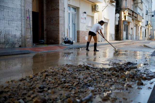 a person swipes the street after floods caused by heavy rains in alcanar spain september 1 2021 photo reuters a person swipes the street after floods caused by heavy rains in alcanar spain september 1 2021 photo reuters