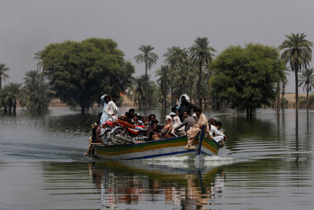flood victims travel in a boat following rains and floods during the monsoon season in talti town in sehwan pakistan september 15 2022 photo reuters file flood victims travel in a boat following rains and floods during the monsoon season in talti town in sehwan pakistan september 15 2022 photo reuters file