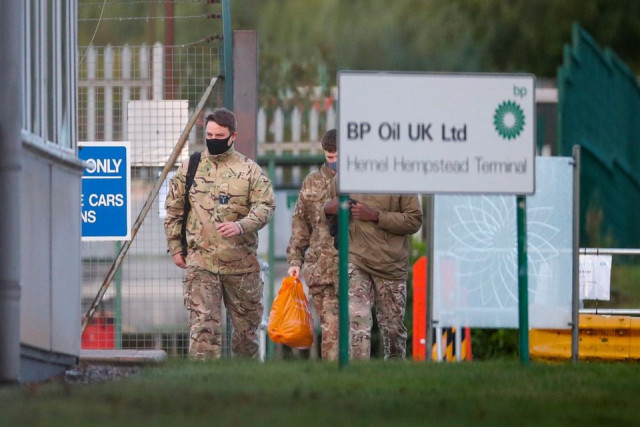 members of the military walk at buncefield oil depot in hemel hempstead britain october 4 2021 reuters members of the military walk at buncefield oil depot in hemel hempstead britain october 4 2021 reuters
