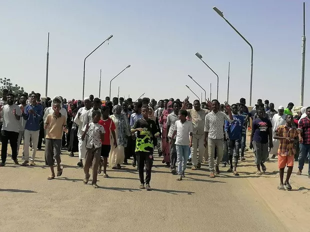 sudanese demonstrators march and chant during a protest against the military takeover in atbara sudan october 27 2021 in this social media image photo reuters sudanese demonstrators march and chant during a protest against the military takeover in atbara sudan october 27 2021 in this social media image photo reuters