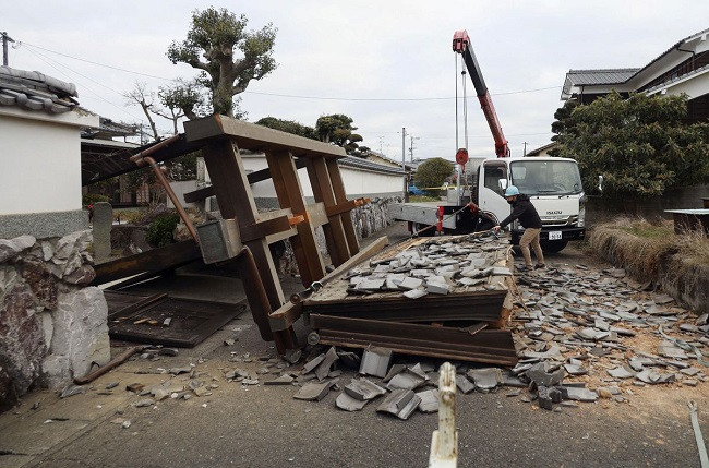a collapsed gate to the residential house caused by an earthquake is seen in oita southern japan january 22 2022 photo reuters