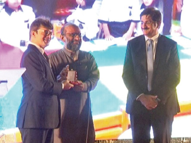 cm murad ali shah looks on as italian consul general danilo giurdanella confers italian civil award for late bilquis edhi to her son faisal edhi photo express