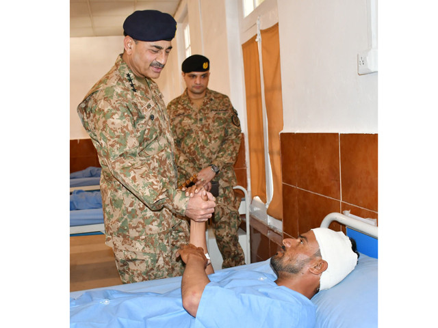 chief of army staff coas general syed asim munir is inquiring an injured soldier during his visit to south waziristan on wednesday august 23 2023 photo ispr