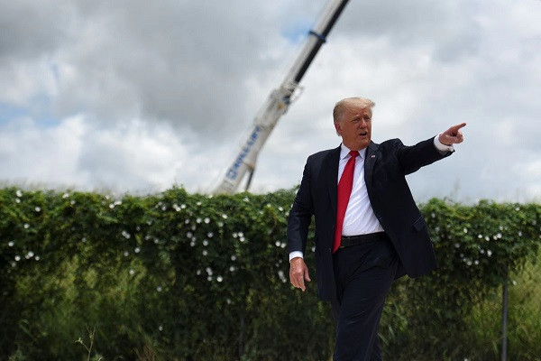 former us president donald trump exits the stage after visiting an unfinished section of the wall along the us mexico border with texas governor greg abbott in pharr texas us june 30 2021 photo reuters