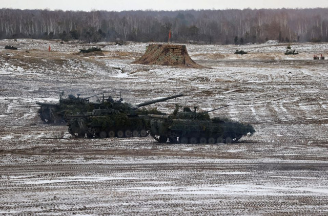 military vehicles are seen during the joint exercises of the armed forces of russia and belarus at a firing range in the brest region belarus february 3 2022 vadim yakubyonok belta handout via reuters military vehicles are seen during the joint exercises of the armed forces of russia and belarus at a firing range in the brest region belarus february 3 2022 vadim yakubyonok belta handout via reuters