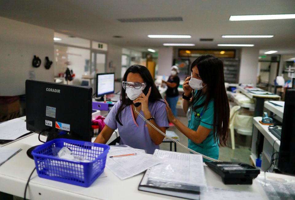 healthcare workers speak on the phone at an intensive care unit of a hospital prepared for patients suffering from the coronavirus disease covid 19 on the outskirts of buenos aires argentina april 16 2021 photo reuters