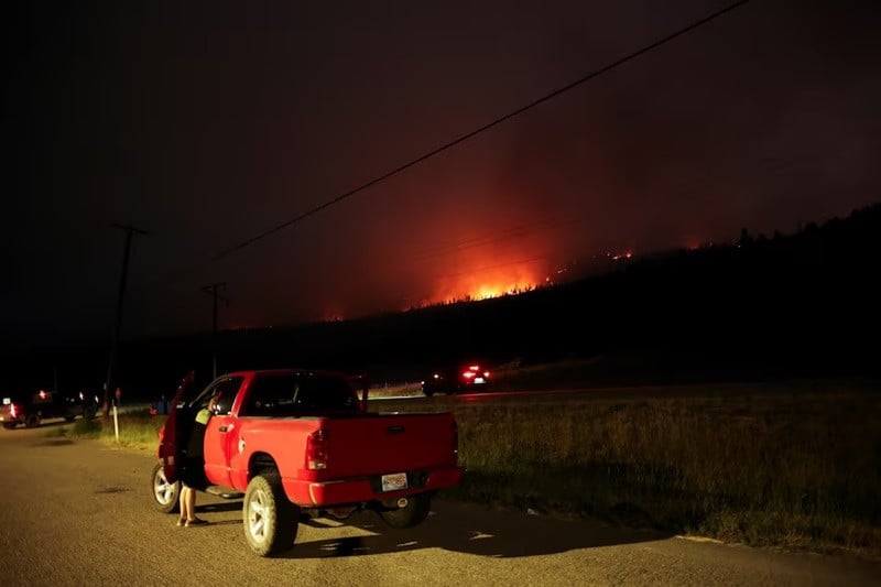 local residents park on highway 1 to watch flames from the shetland creek wildfire outside ashcroft british columbia canada july 19 2024 photo reuters
