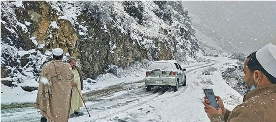 a vehicle struggles through a slippery road in landi kotal after heavy snowfall photo express