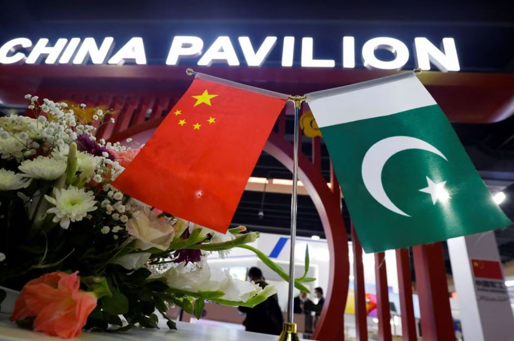 flags of pakistan and china are seen at the entrance of the china pavilion during the international defence exhibition and seminar ideas 2022 in karachi pakistan november 16 2022 reuters