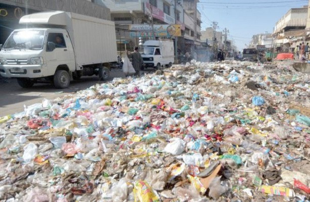 cleanup needed piles of garbage lie along a busy road in karachi waste management remains an issue in the metropolitan city photo jalal qureshi express