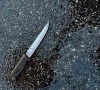 a knife found at the scene lies on pavement after a man who was later shot dead by police killed four members of his extended family including two children and stabbed two police officers at a home in the queens borough of new york city u s december 3 2023 photo reuters