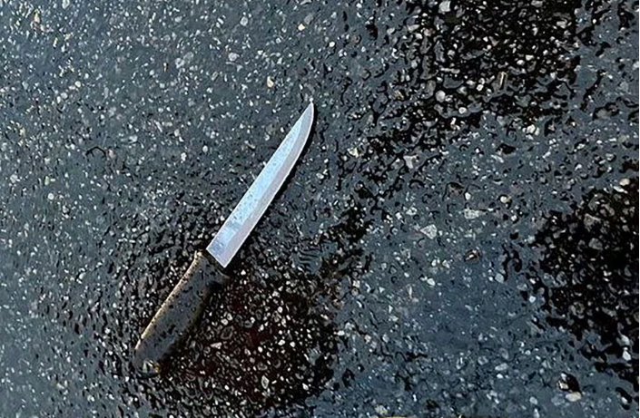 a knife found at the scene lies on pavement after a man who was later shot dead by police killed four members of his extended family including two children and stabbed two police officers at a home in the queens borough of new york city u s december 3 2023 photo reuters