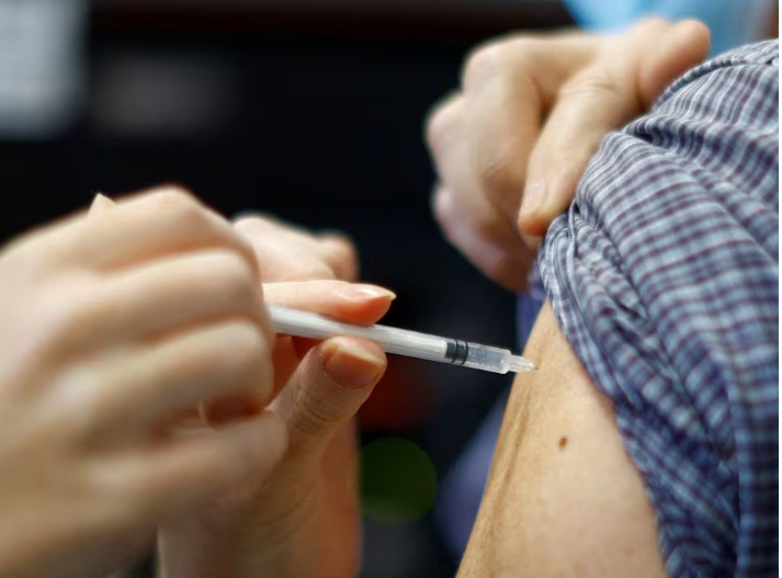 a medical worker administers a dose of the cominarty pfizer bivalent coronavirus disease covid 19 vaccine to a patient at a vaccination center in nice as a new surge in the covid 19 outbreak starts in france december 7 2022 photo reuters