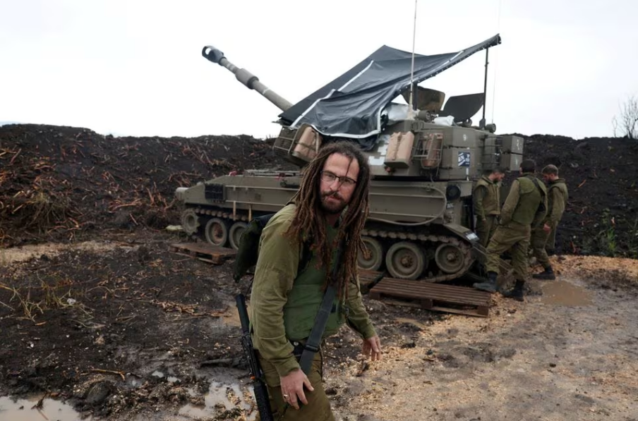 an israeli soldier stands by a mobile artillery unit near the israel lebanon border in northern israel january 15 2024 photo reuters