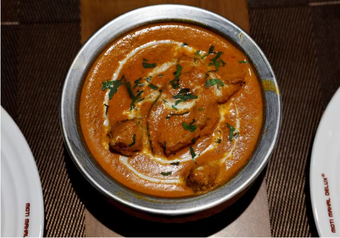 a freshly prepared butter chicken dish is placed on a table inside the moti mahal delux restaurant in new delhi india january 23 2024 photo reuters