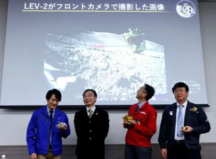 daichi hirano hitoshi kuninaka shinichiro sakai and masatsugu otsuki from the japan aerospace exploration agency jaxa smile in front of a screen showing an image taken by lev 2 on the moon after their press conference on slim s moon landing mission in tokyo japan january 25 2024 photo reuters daichi hirano hitoshi kuninaka shinichiro sakai and masatsugu otsuki from the japan aerospace exploration agency jaxa smile in front of a screen showing an image taken by lev 2 on the moon after their press conference on slim s moon landing mission in tokyo japan january 25 2024 photo reuters