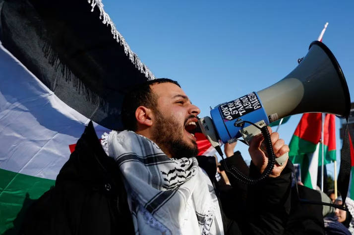 a person shouts slogans during a pro palestinian demonstration outside the international court of justice icj as judges rule on emergency measures against israel following accusations by south africa that the israeli military operation in gaza is a state led genocide in the hague netherlands january 26 2024 photo reuters