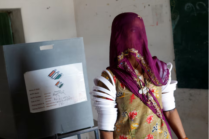 a woman leaves after casting her vote at a polling station during the second phase of the general elections in barmer rajasthan india april 26 2024 reuters adnan abidi