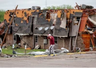 a man walks past a damaged building after it was hit by a tornado the night before in sulphur oklahoma u s april 28 2024 bryan terry the oklahoman usa today network via reuters