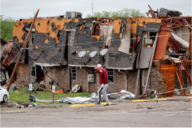 a man walks past a damaged building after it was hit by a tornado the night before in sulphur oklahoma u s april 28 2024 bryan terry the oklahoman usa today network via reuters a man walks past a damaged building after it was hit by a tornado the night before in sulphur oklahoma u s april 28 2024 bryan terry the oklahoman usa today network via reuters