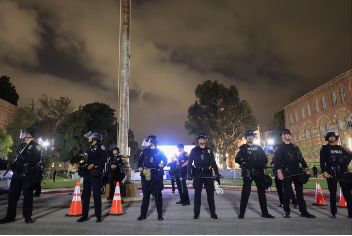 chp officers stand guard near an area showing messages of support for israeli hostages in gaza amid clashes at a nearby pro palestinian encampment on the university of california los angeles ucla campus in los angeles california u s may 1 2024 reuters david swanson