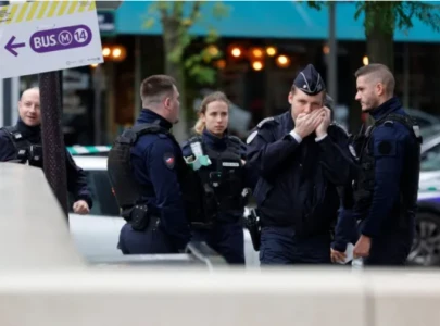 paris officer fighting for life after police station shooting