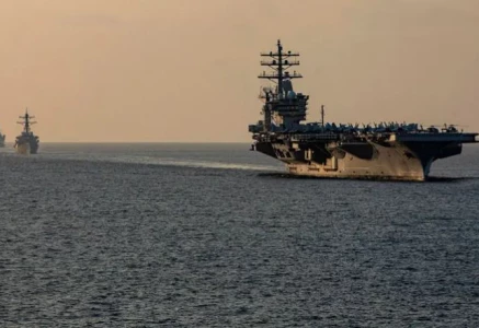 components of the dwight d eisenhower carrier strike group ikecsg guided missile destroyer uss stethem ddg 63 and french navy frigate fs languedoc d 653 transit the strait of hormuz on november 25 2023 photo reuters