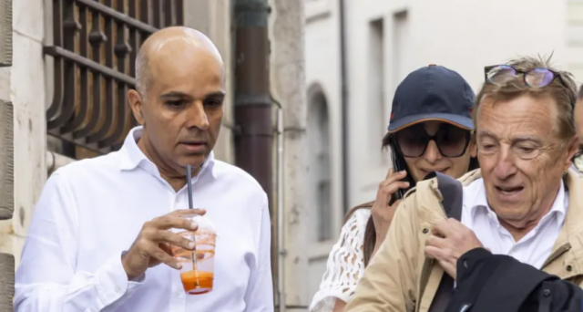 ajay hinduja l and his wife namrata arrive with their lawyer robert assael at a court house in geneva