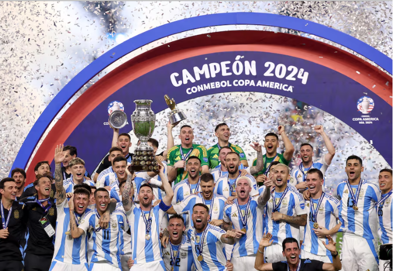 soccer football   copa america 2024   final   argentina v colombia   hard rock stadium miami florida united states   july 15 2024 argentina s lionel messi lifts the trophy as he celebrates with teammates after winning copa america 2024 reuters agustin marcarian