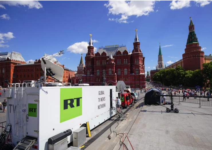russian state broadcaster rt broadcasting from near red square during the 2018 world cup in moscow the justice department alleges an rt employee was behind an ai powered effort to create fake social media profiles of americans to spread russian propaganda in the u s christopher furlong getty images
