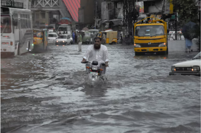 a man rides on a motorcycle amid flood waters along a road during the monsoon season in rawalpindi pakistan july 19 2023 reuters waseem khan a man rides on a motorcycle amid flood waters along a road during the monsoon season in rawalpindi pakistan july 19 2023 reuters waseem khan