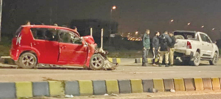 police inspect the accident scene in which a woman was killed and her two friends critically injured photo express