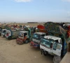 trucks loaded with afghans and their belongings wait to cross at chaman in pakistan earlier in november photo afp