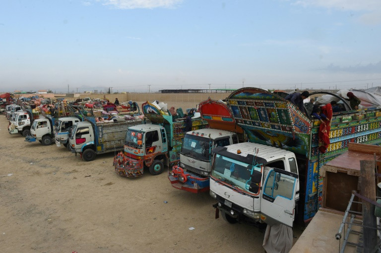 trucks loaded with afghans and their belongings wait to cross at chaman in pakistan earlier in november photo afp